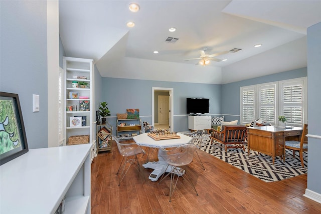 dining room featuring ceiling fan, vaulted ceiling, and hardwood / wood-style flooring