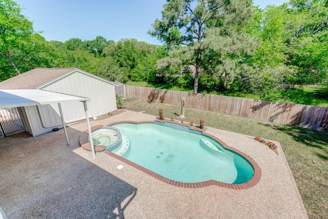 view of swimming pool with an in ground hot tub and a patio