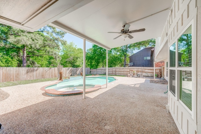 view of swimming pool featuring a patio area, ceiling fan, and an in ground hot tub