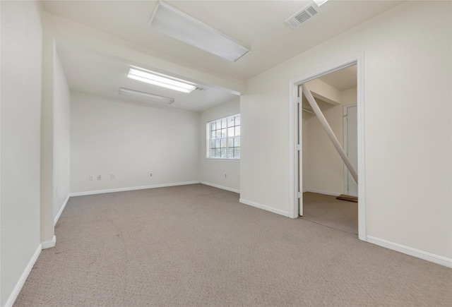 spare room with light colored carpet