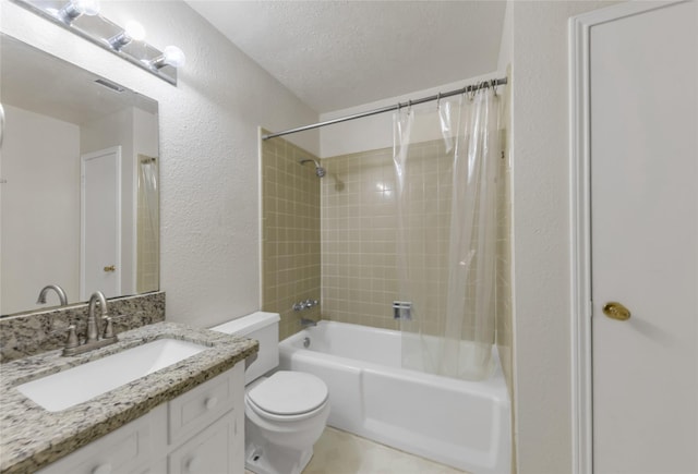 full bathroom with vanity, a textured ceiling, shower / tub combo with curtain, and toilet