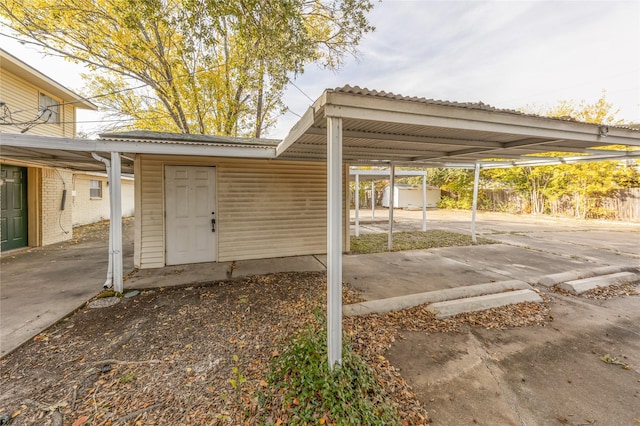 view of parking / parking lot with a carport