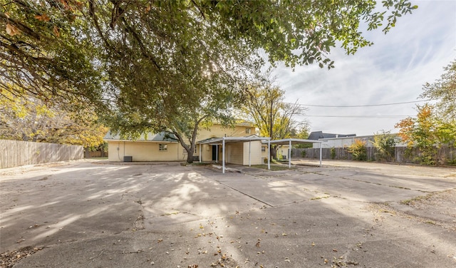 exterior space with a carport