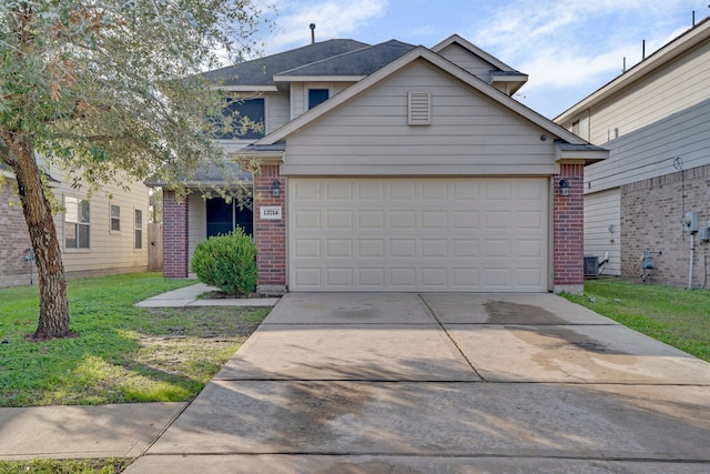 view of front facade featuring a front yard and a garage