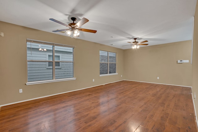 unfurnished room with ceiling fan and wood-type flooring