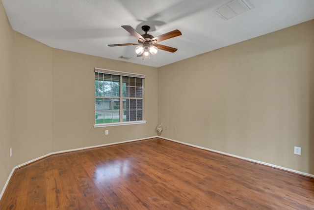 empty room featuring ceiling fan and wood-type flooring