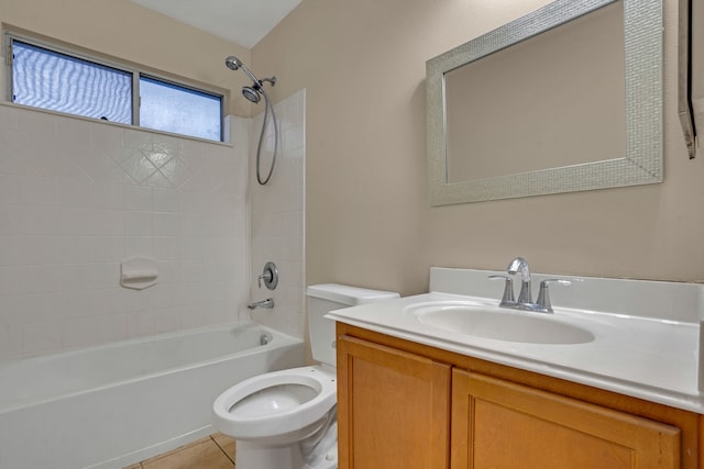 full bathroom featuring tile patterned floors, vanity, toilet, and tiled shower / bath combo