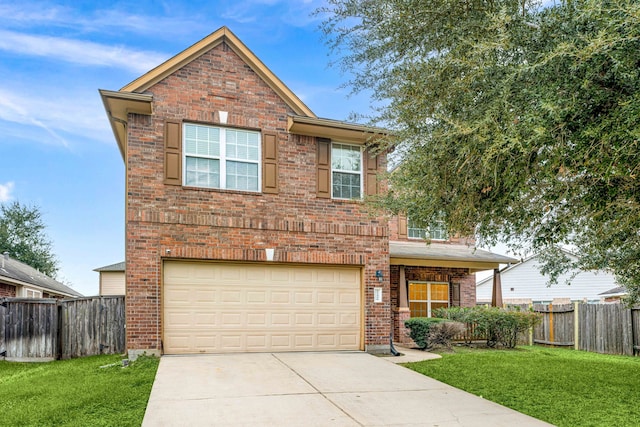 view of front property with a front yard and a garage