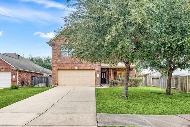 view of front of house with a front lawn and a garage