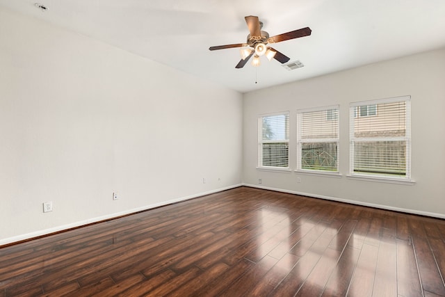 unfurnished room with ceiling fan and dark hardwood / wood-style flooring