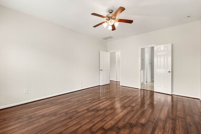 unfurnished room with dark hardwood / wood-style floors and ceiling fan