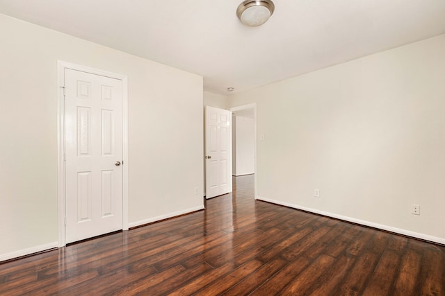 unfurnished bedroom featuring dark hardwood / wood-style floors