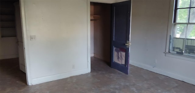 1370 Plum St, Beaumont, TX 77703 - unfurnished bedroom with baseboards and tile patterned floors