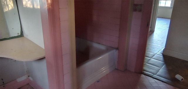 1370 Plum St, Beaumont, TX 77703 - full bath featuring a bathtub and tile patterned floors