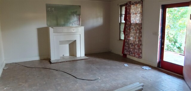 1370 Plum St, Beaumont, TX 77703 - unfurnished living room with baseboards