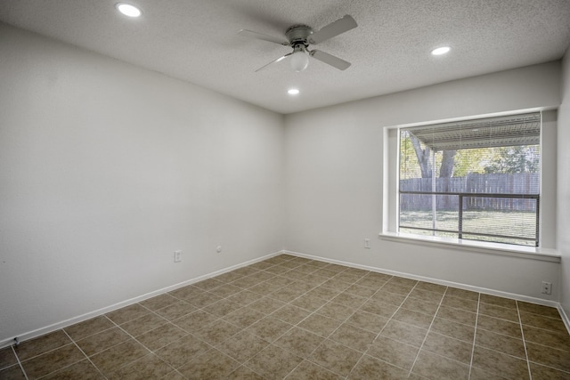 unfurnished room featuring a textured ceiling and ceiling fan