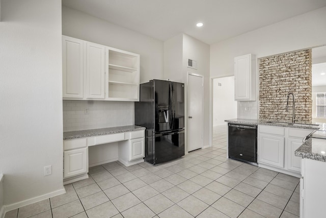 kitchen featuring black appliances, white cabinetry, and tasteful backsplash