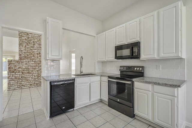 kitchen featuring white cabinets, a healthy amount of sunlight, and black appliances