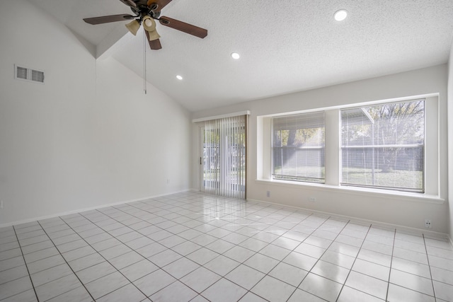 spare room featuring light tile patterned floors, a textured ceiling, and ceiling fan