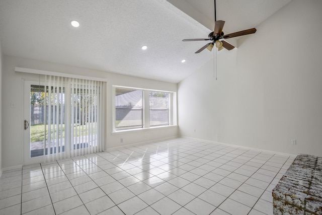 tiled spare room featuring a textured ceiling, high vaulted ceiling, and ceiling fan