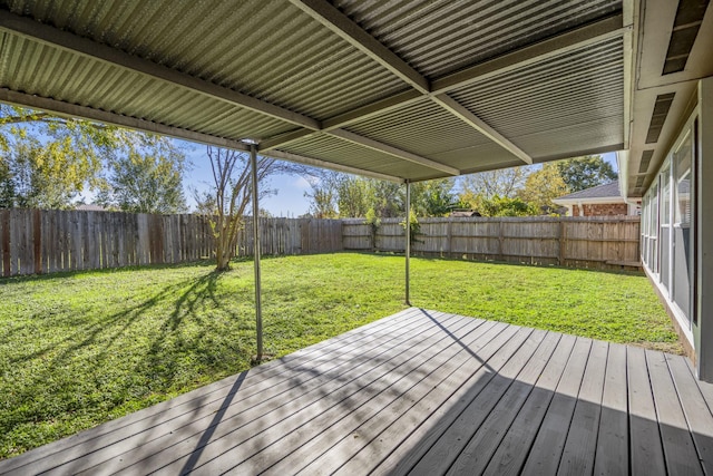 wooden terrace featuring a yard