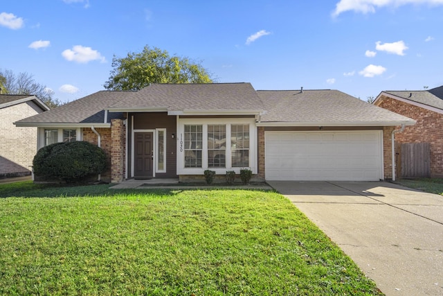 ranch-style home featuring a front yard and a garage