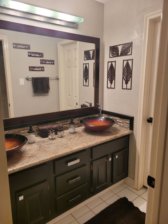 bathroom featuring tile patterned floors and vanity