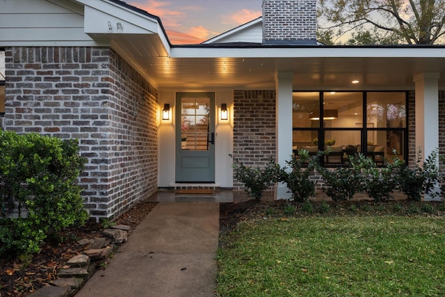 exterior entry at dusk with a porch