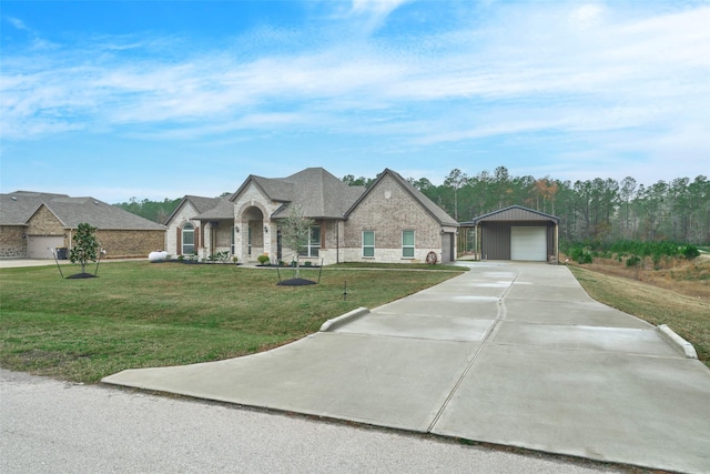 french provincial home featuring a garage and a front lawn