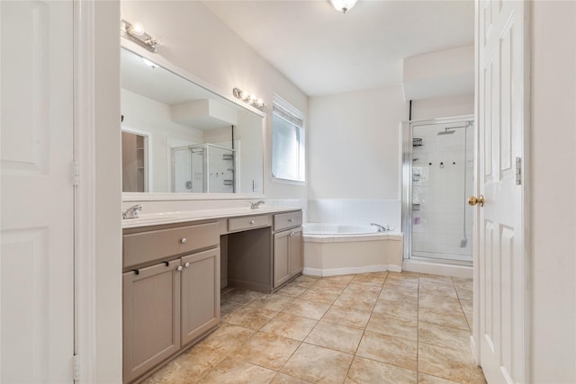 bathroom with tile patterned flooring, vanity, and shower with separate bathtub