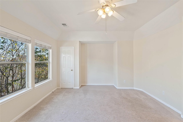 spare room featuring ceiling fan and light colored carpet