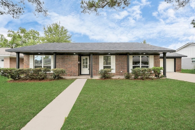 single story home with a front yard and a garage