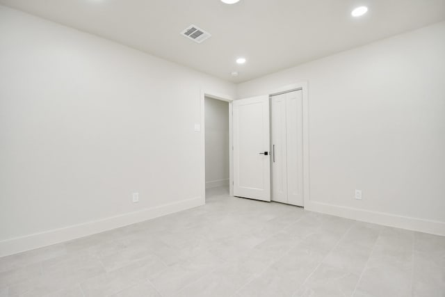 spare room with light tile patterned floors