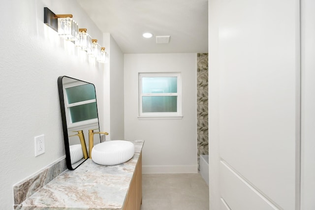 bathroom with concrete floors