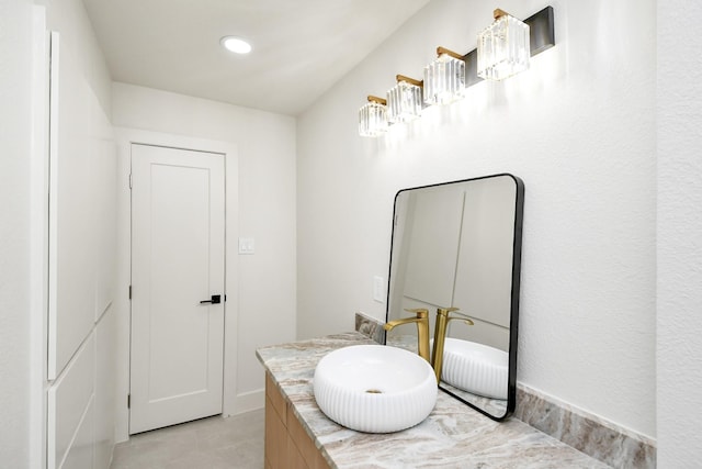 bathroom with tile patterned flooring and vanity