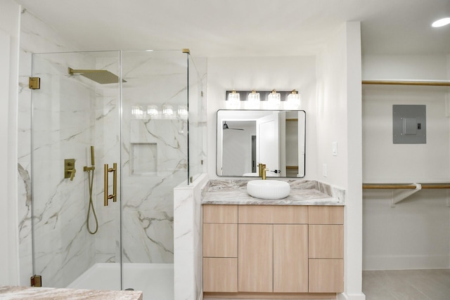 bathroom with vanity, electric panel, and a shower with door