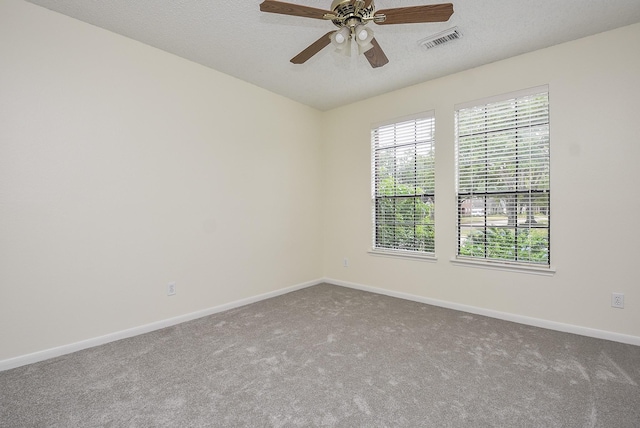 empty room with carpet, a textured ceiling, and ceiling fan