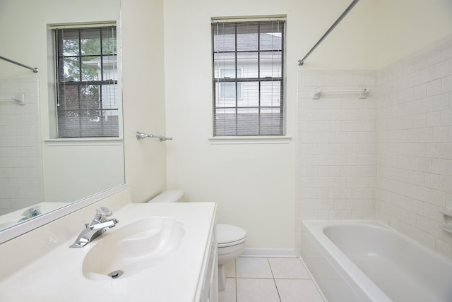 full bathroom featuring tile patterned flooring, vanity, toilet, and tiled shower / bath