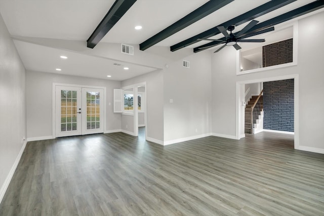 unfurnished living room featuring hardwood / wood-style floors, vaulted ceiling with beams, french doors, and ceiling fan