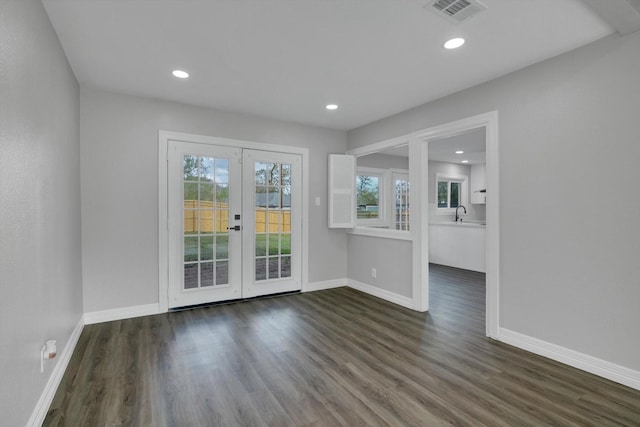 interior space with french doors, dark hardwood / wood-style floors, and sink