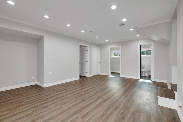 interior space featuring hardwood / wood-style flooring and crown molding