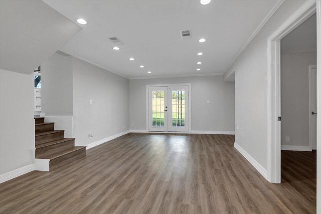 unfurnished living room with wood-type flooring, crown molding, and french doors