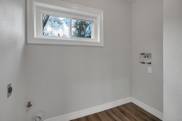 clothes washing area with washer hookup, dark hardwood / wood-style floors, gas dryer hookup, and electric dryer hookup