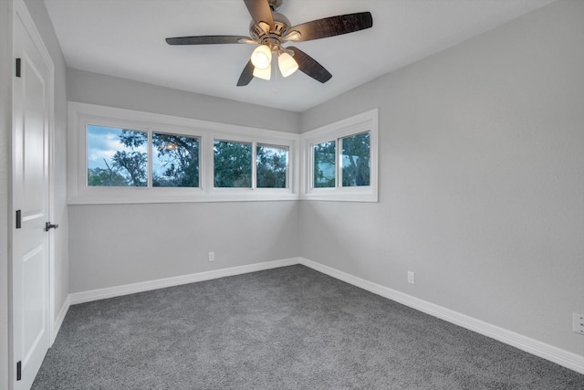 empty room featuring carpet flooring and ceiling fan