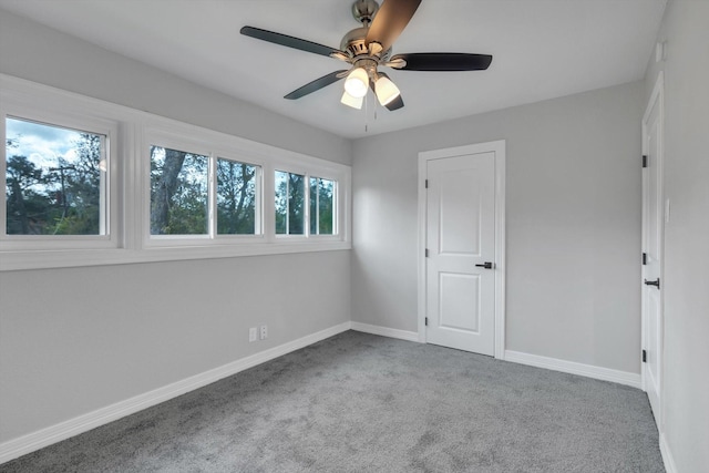 unfurnished bedroom featuring ceiling fan and carpet floors