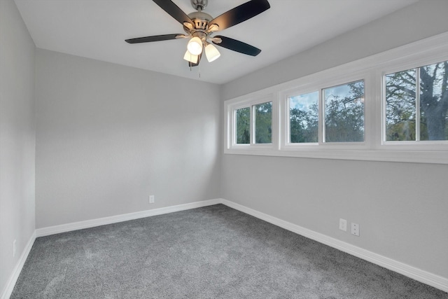 carpeted empty room featuring ceiling fan