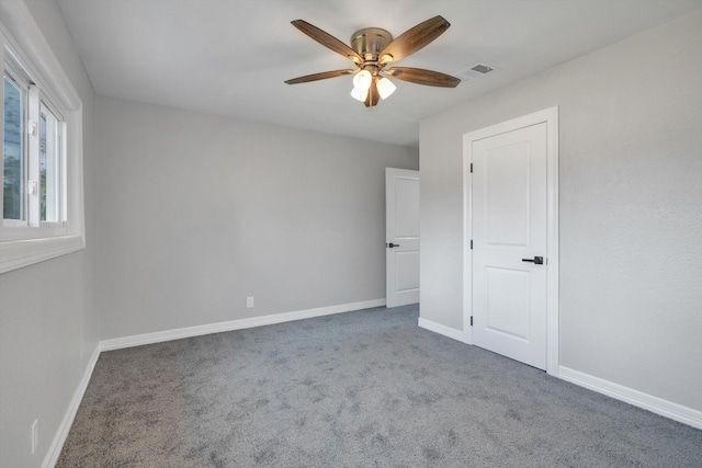 unfurnished room featuring carpet flooring and ceiling fan