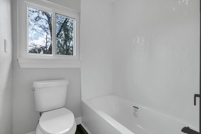 bathroom featuring a bathing tub and toilet