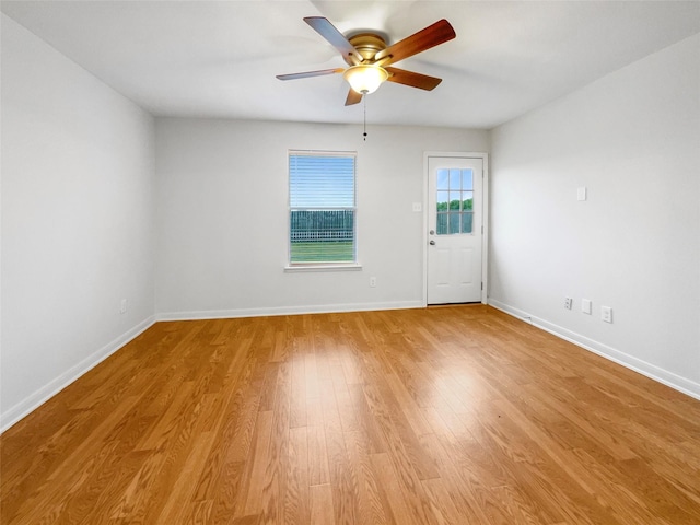 empty room featuring light wood-type flooring and ceiling fan