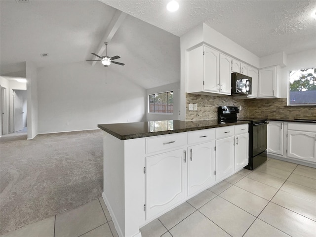 kitchen featuring light carpet, black appliances, kitchen peninsula, vaulted ceiling with beams, and white cabinetry